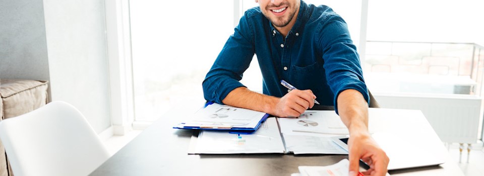 graphicstock-photo-of-young-cheerful-bristle-man-analyzing-finances-and-holding-newspaper-in-hand_H_lc6FnBnx_PMNW.jpg